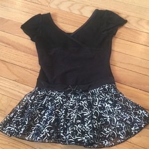 Black leotard with attached skirt